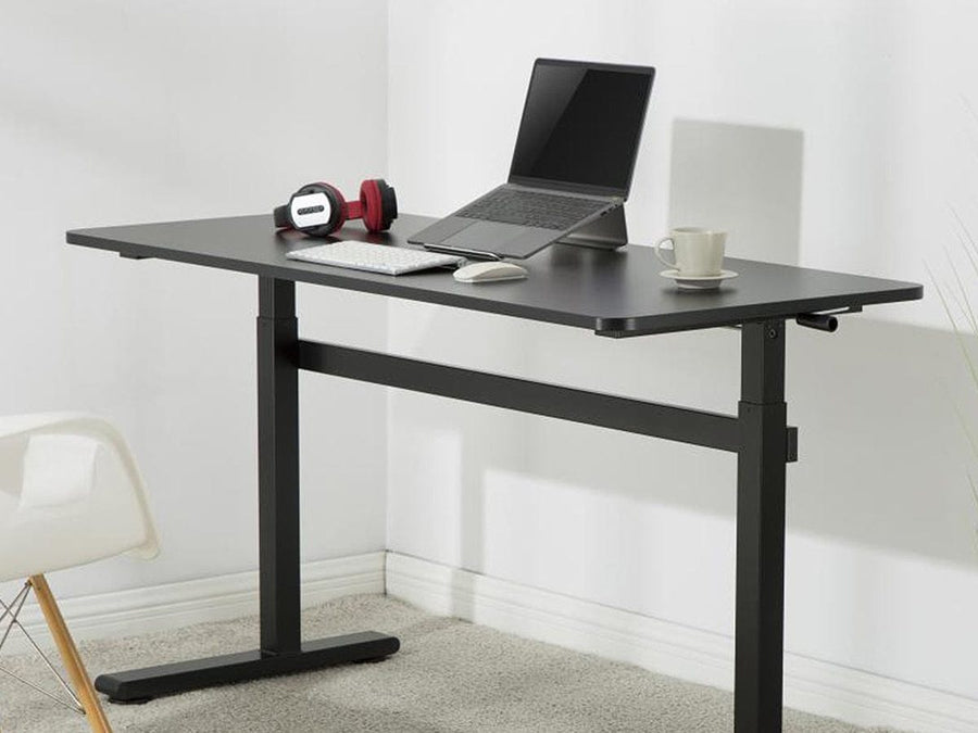 Desky Zero Manual Sit Stand Desk in Black with a laptop stand